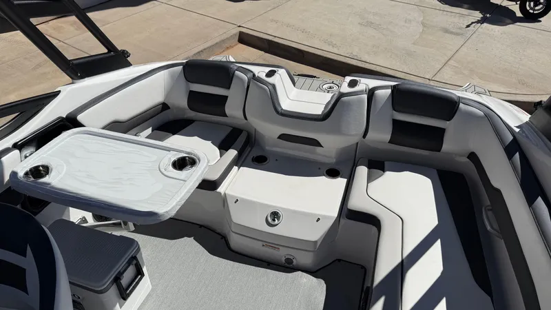 Slide: The Image of 2025 Yamaha AR195 boat interior with seating and table, featuring modern design and comfort. - 32