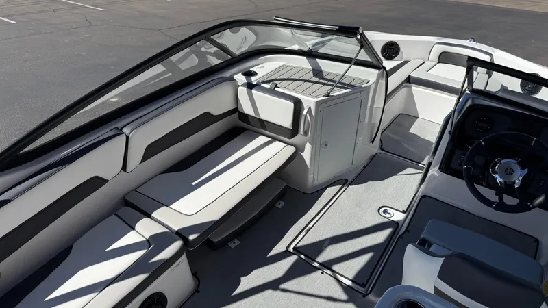 Slide: The Image of 2025 Yamaha Boats AR195 interior with sleek seating and modern dashboard design. - 33