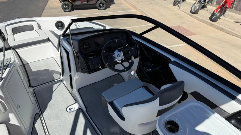 Slide: The Image of 2025 Yamaha Boats AR195 interior with sleek design and modern dashboard. - 34