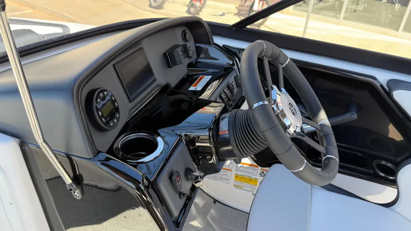 Slide: The Image of 2025 Yamaha Boats AR195 dashboard with steering wheel and control panel. - 35