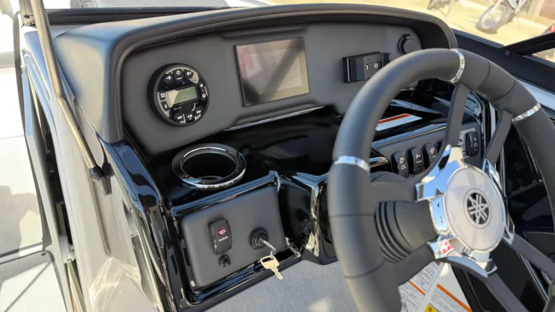 Slide: The Image of 2025 Yamaha Boats AR195 dashboard with steering wheel and control panel. - 36