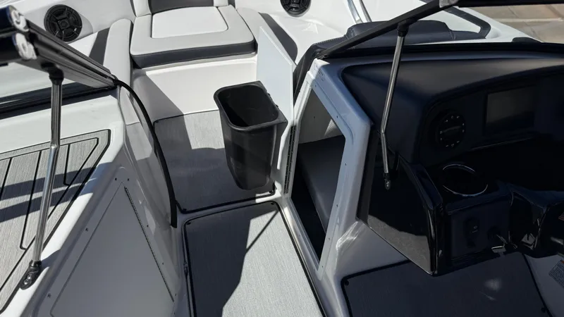 Slide: The Image of 2025 Yamaha Boats AR195 interior with seating, storage, and dashboard features. - 39