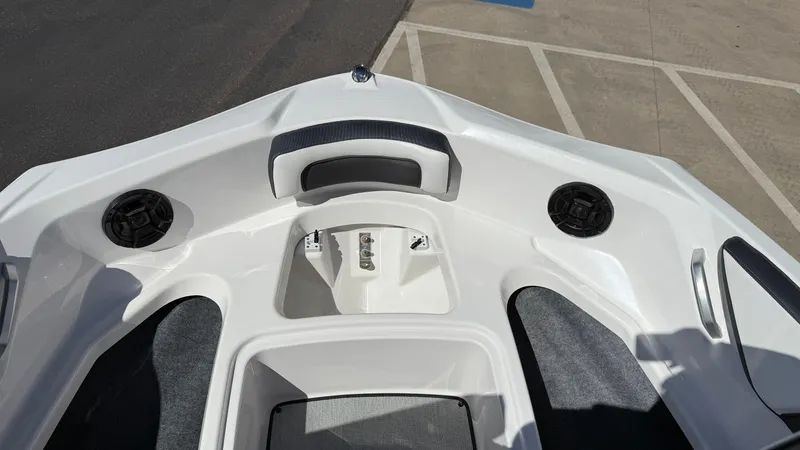 Slide: The Image of 2025 Yamaha Boats AR195 bow interior with speakers and seating. - 46