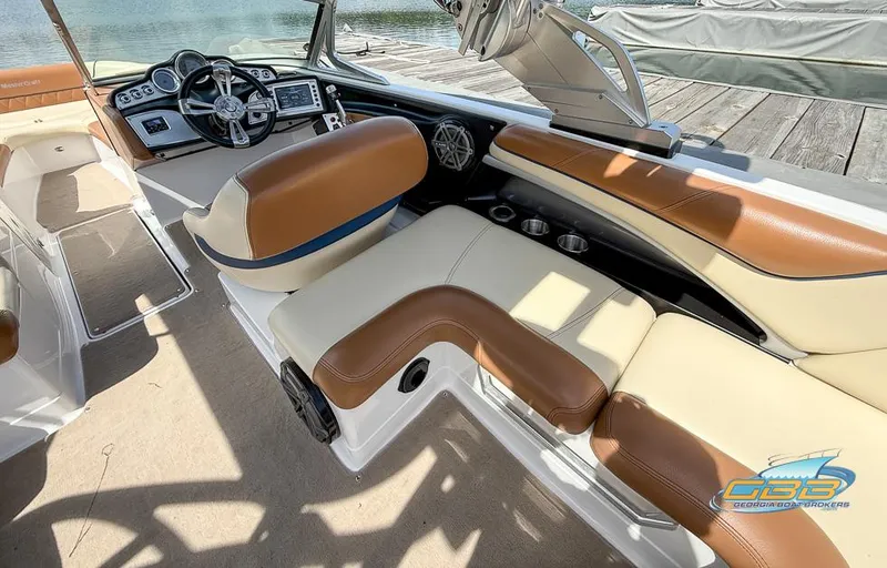 Slide: The Image of Interior of a 2013 MasterCraft X-45 boat with tan and brown seating. - 11