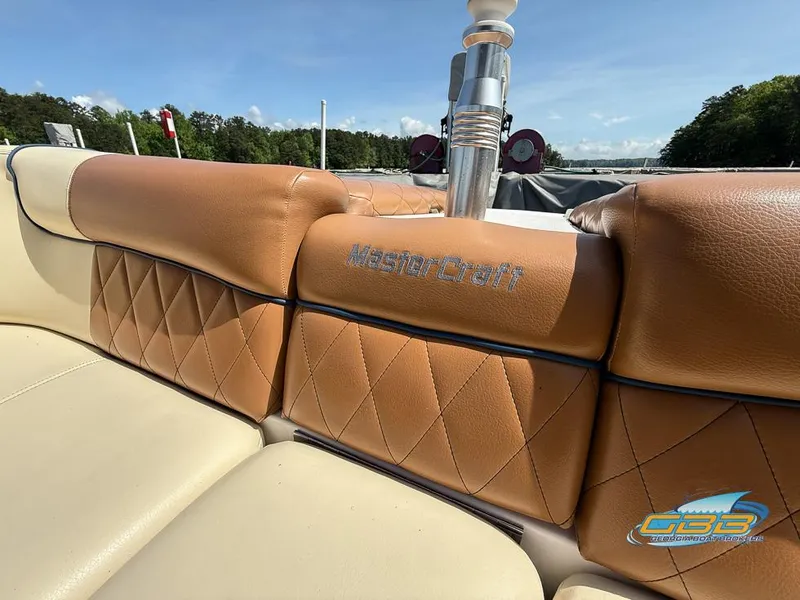 Slide: The Image of 2013 MasterCraft X-45 boat interior with tan leather seating and logo detail. - 14