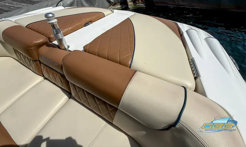 Slide: The Image of 2013 MasterCraft X-45 boat with tan and cream leather seating, featuring diamond stitching. - 15