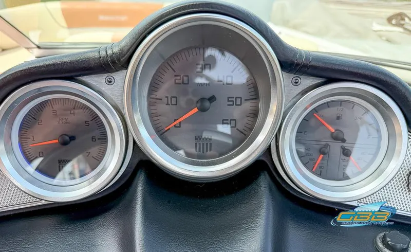 Slide: The Image of Dashboard of a 2013 MasterCraft X-45 boat with speedometer and gauges. - 22