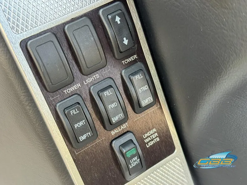 Slide: The Image of Control panel of a 2013 MasterCraft X-45 boat with various switches. - 23