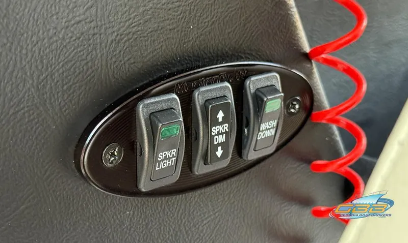 Slide: The Image of Control panel of a 2013 MasterCraft X-45 boat with speaker and washdown switches. - 24