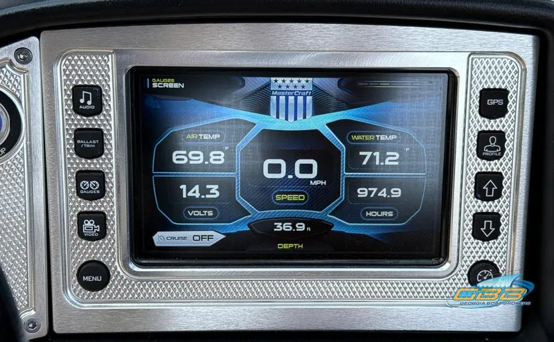 Slide: The Image of 2013 MasterCraft X-45 dashboard display showing air and water temperature, speed, and other metrics. - 26