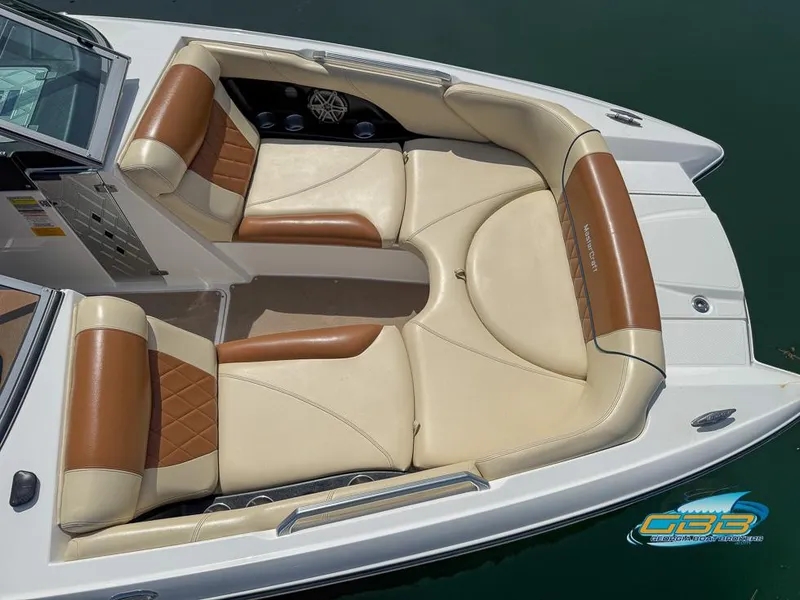 Slide: The Image of 2013 MasterCraft X-45 boat interior with tan and brown seating, viewed from above. - 3