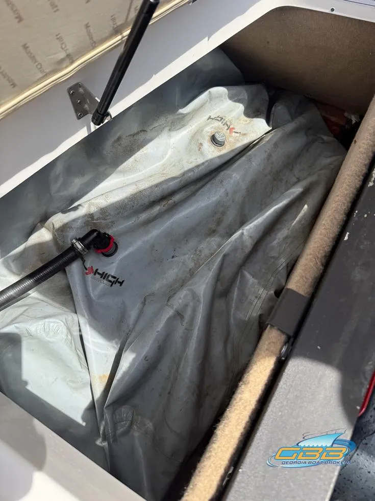 Slide: The Image of 2013 MasterCraft X-45 storage compartment with ballast bag inside. - 30