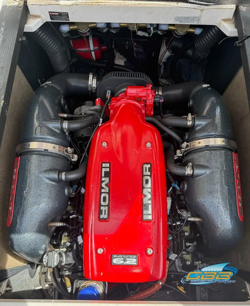 Slide: The Image of 2013 MasterCraft X-45 engine with red Ilmor cover, showcasing powerful marine performance. - 31