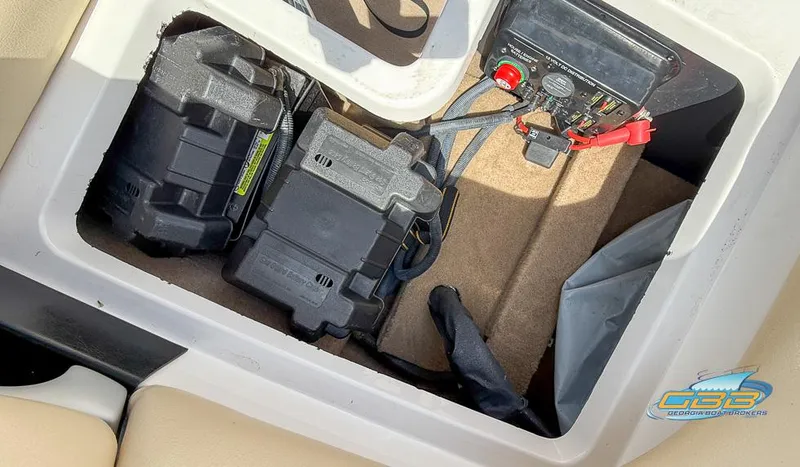 Slide: The Image of 2013 MasterCraft X-45 battery compartment with wiring and components. - 34