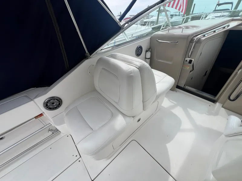 Slide: The Image of 2005 Sea Ray 290 Amberjack boat interior with white seating and modern design. - 10