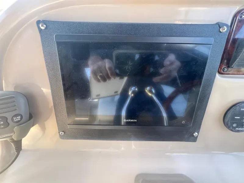 Slide: The Image of Garmin display on 2005 Sea Ray 290 Amberjack boat dashboard. - 24