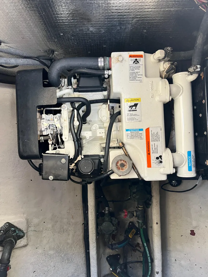 Slide: The Image of Engine compartment of a 2005 Sea Ray 290 Amberjack boat. - 26