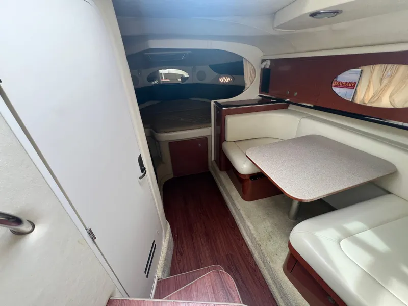 Slide: The Image of Interior of 2005 Sea Ray 290 Amberjack boat with dining area and sleeping quarters. - 3