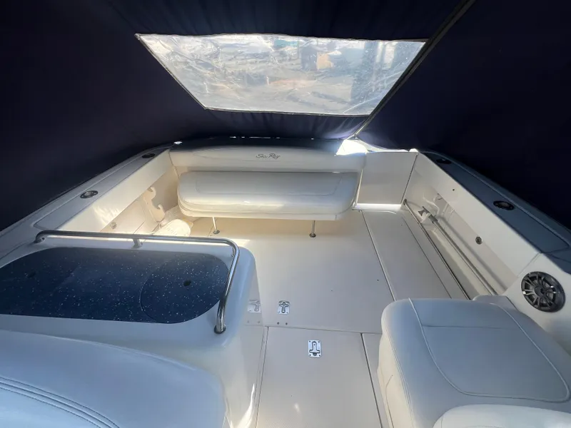 Slide: The Image of 2005 Sea Ray 290 Amberjack interior with seating and covered deck. - 4
