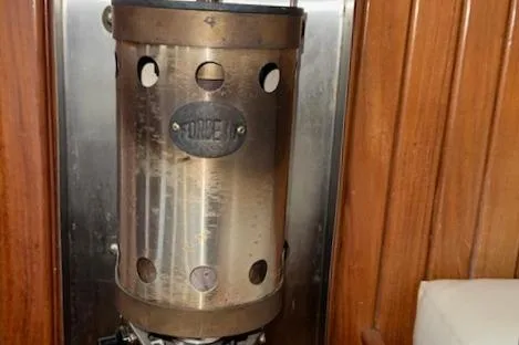 Slide: The Image of Vintage heater inside 1986 Cabo Rico CB38 yacht with wooden paneling. - 10