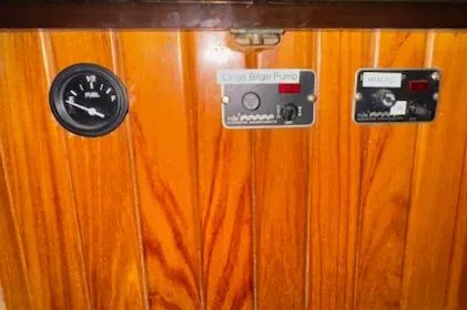 Slide: The Image of Wooden panel with gauges and controls on a 1986 Cabo Rico CB38 yacht. - 14