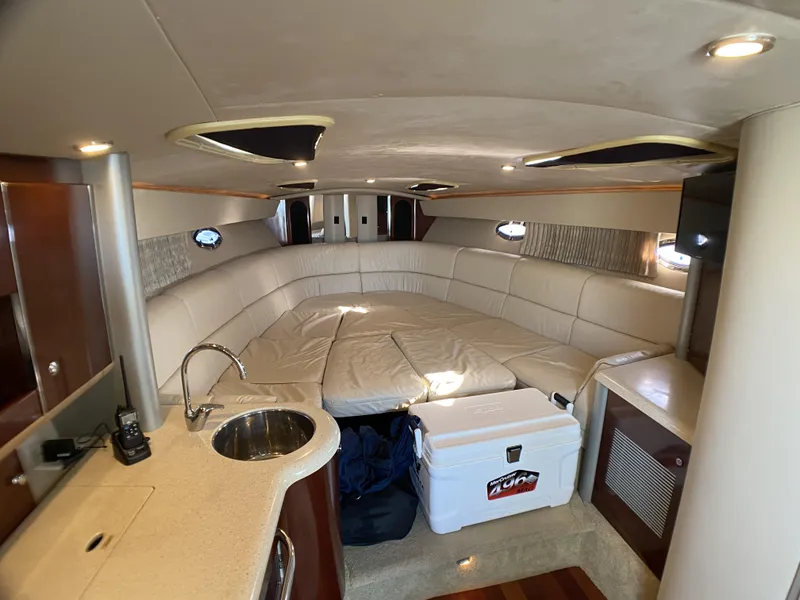 Slide: The Image of 2006 Formula 400 Super Sport cabin with cozy seating and kitchenette. - 13