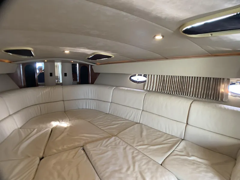 Slide: The Image of Interior of 2006 Formula 400 Super Sport yacht with plush white seating. - 22