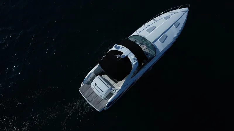 Slide: The Image of Aerial view of 2006 Formula 400 Super Sport boat on dark water. - 8