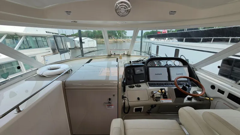 Slide: The Image of 2007 Sea Ray 40 Motor Yacht helm with modern controls and panoramic view. - 11
