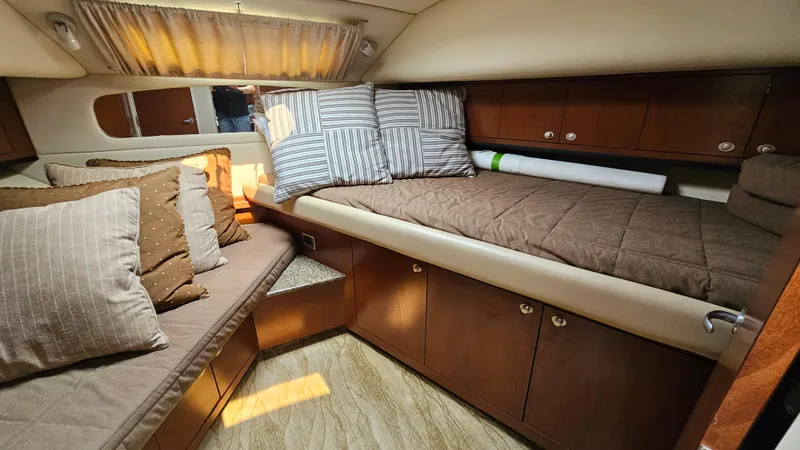 Slide: The Image of Luxurious 2007 Sea Ray 40 Motor Yacht cabin with cozy bedding and elegant wood cabinetry. - 18