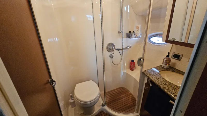 Slide: The Image of Bathroom interior of 2007 Sea Ray 40 Motor Yacht with shower, toilet, and sink. - 21