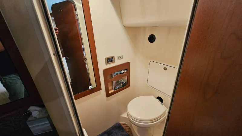 Slide: The Image of Bathroom interior of 2007 Sea Ray 40 Motor Yacht, featuring compact design and amenities. - 27