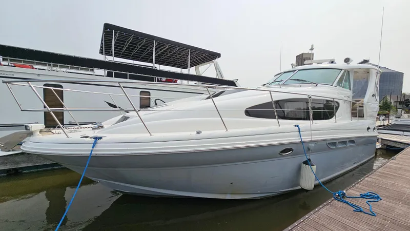 Slide: The Image of 2007 Sea Ray 40 Motor Yacht docked at marina, side view. - 4