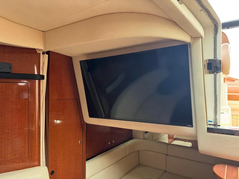 Slide: The Image of Interior of 2003 Sea Ray 340 Sundancer with mounted flat-screen TV. - 25