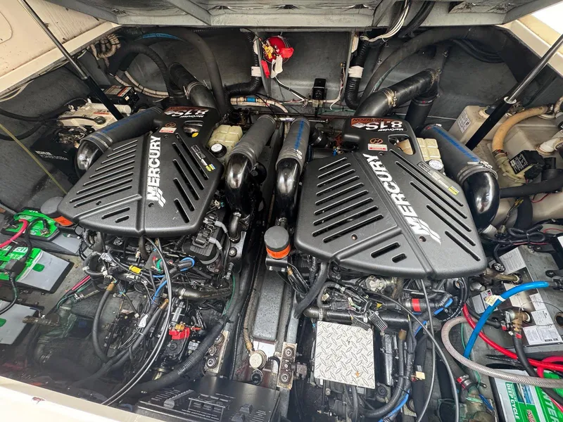 Slide: The Image of Engine compartment of a 2003 Sea Ray 340 Sundancer with twin Mercury engines. - 27