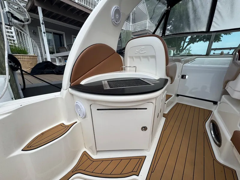 Slide: The Image of 2003 Sea Ray 340 Sundancer boat interior with seating and wood flooring. - 8