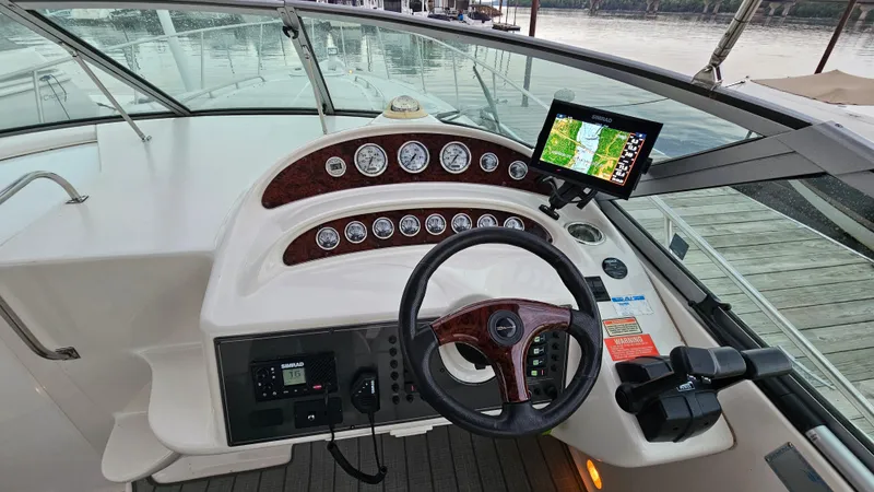 Slide: The Image of 2003 Monterey 322 Cruiser dashboard with steering wheel and navigation display. - 12