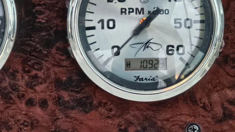 Slide: The Image of Close-up of a 2003 Monterey 322 Cruiser RPM gauge displaying 1092 hours. - 24