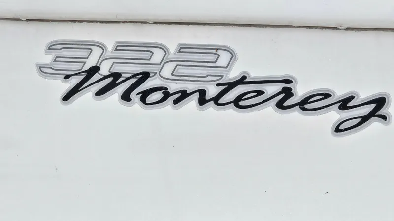 Slide: The Image of 2003 Monterey 322 Cruiser logo on white background. - 25