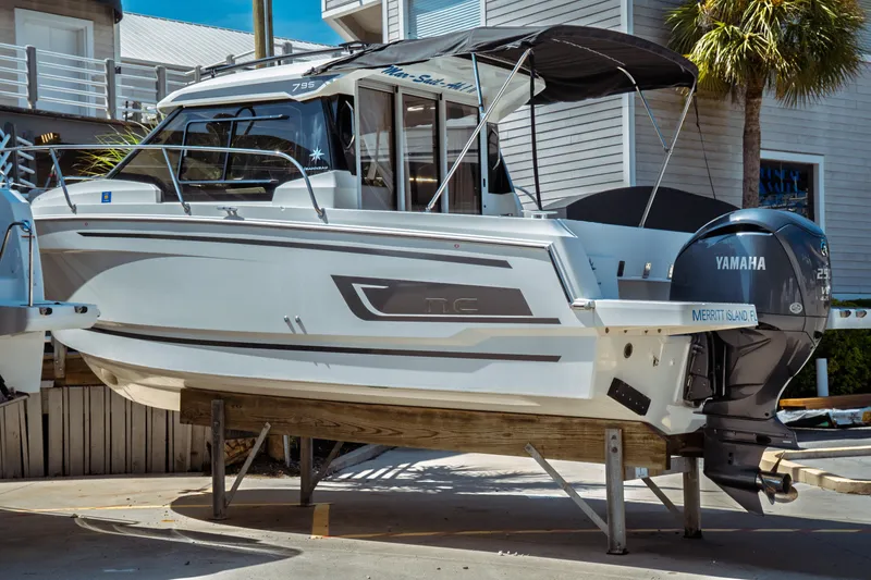 The Image of 2023 Jeanneau NC Weekender 795 Series 2 boat with Yamaha engine on display. - 0