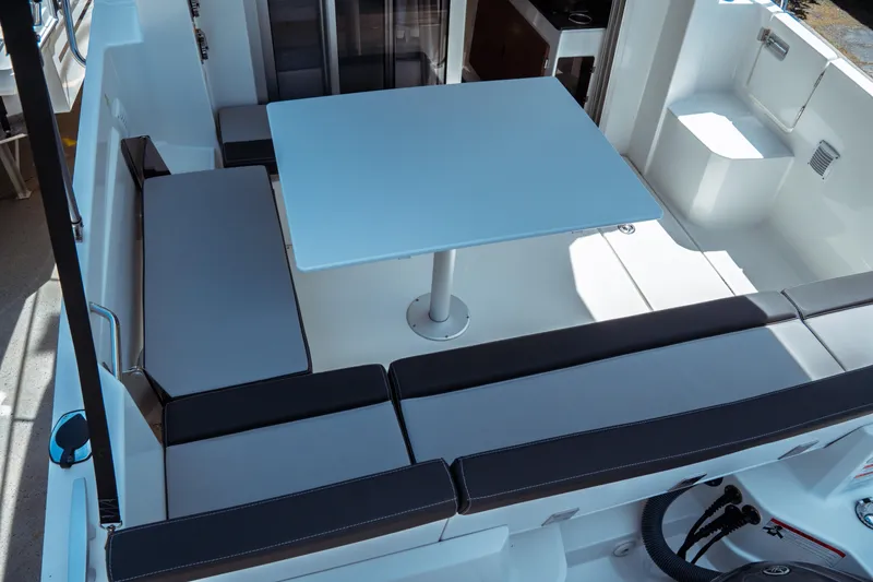 Slide: The Image of 2023 Jeanneau NC Weekender 795 Series 2 boat interior with seating and table. - 28