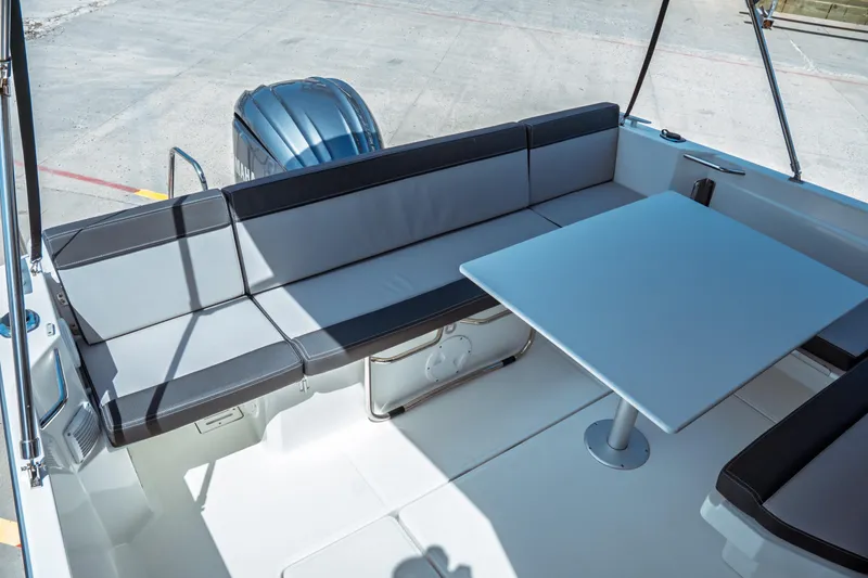 Slide: The Image of 2023 Jeanneau NC Weekender 795 Series 2 boat interior with seating and table. - 29