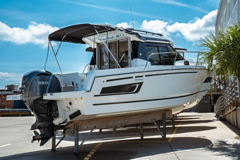 Slide: The Image of 2023 Jeanneau NC Weekender 795 Series 2 boat with Yamaha engine, docked outdoors. - 3