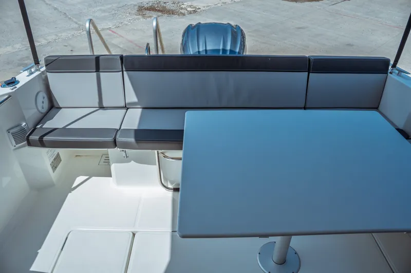 Slide: The Image of 2023 Jeanneau NC Weekender 795 Series 2 boat interior with seating and table. - 31