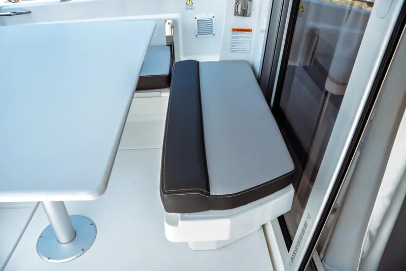 Slide: The Image of 2023 Jeanneau NC Weekender 795 Series 2 interior seating and table detail. - 32
