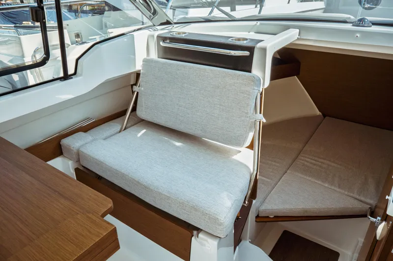 Slide: The Image of Interior of 2023 Jeanneau NC Weekender 795 Series 2, featuring seating and cabin area. - 40