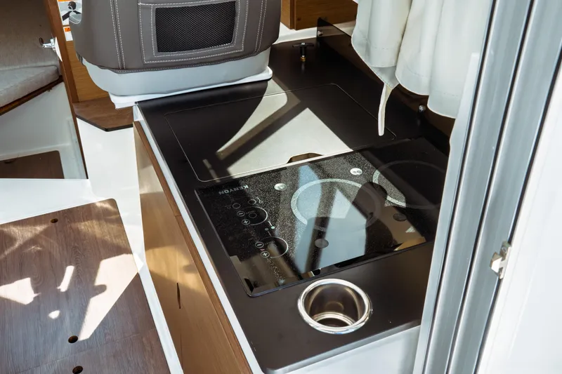 Slide: The Image of 2023 Jeanneau NC Weekender 795 Series 2 interior with modern kitchen amenities. - 43