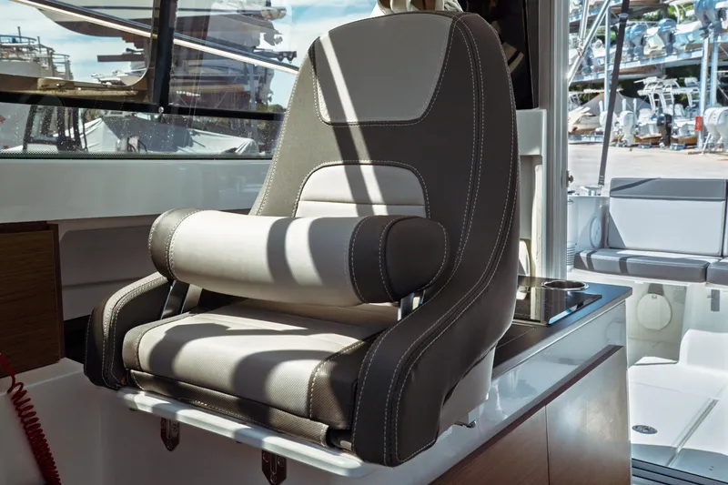 Slide: The Image of Captain's seat on 2023 Jeanneau NC Weekender 795 Series 2 boat interior. - 47