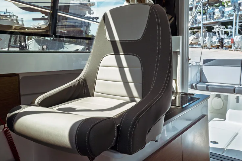 Slide: The Image of Captain's seat on 2023 Jeanneau NC Weekender 795 Series 2 boat interior. - 48