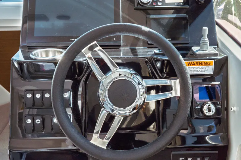 Slide: The Image of Steering wheel and dashboard of 2023 Jeanneau NC Weekender 795 Series 2 boat. - 51